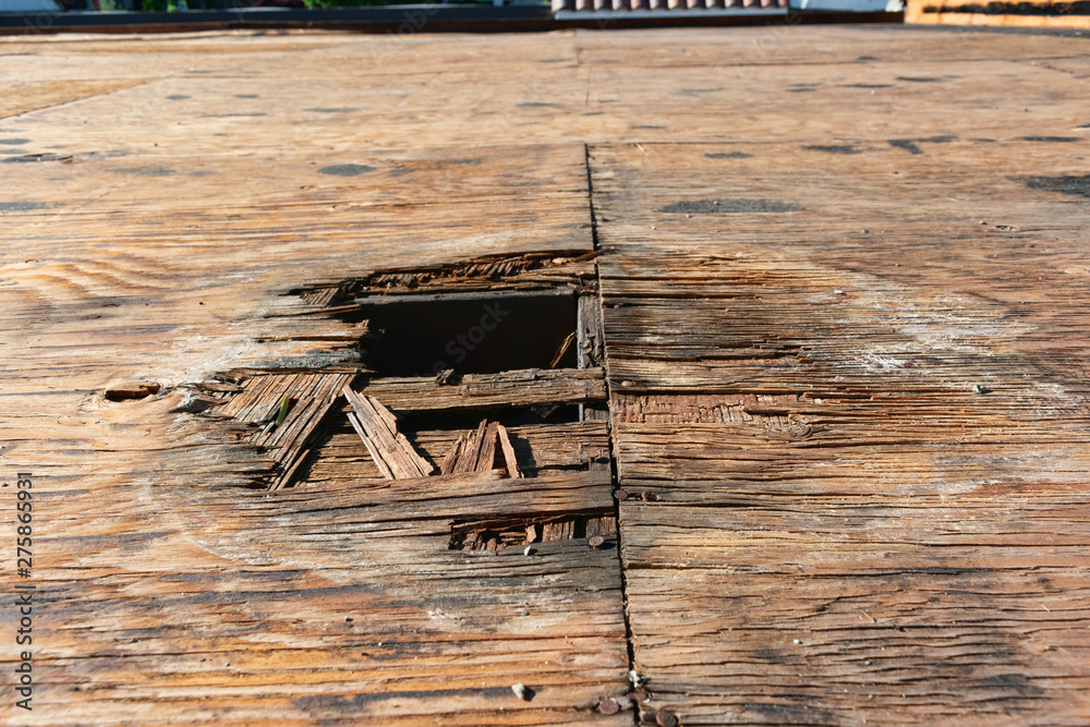 Plywood decking damage and water stains from rain water standing