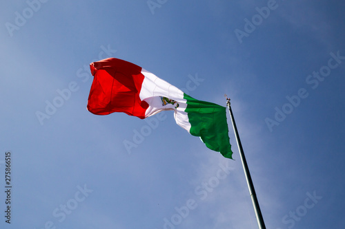 Flag of Mexico over blue sky photo