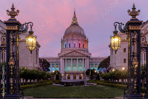Twilight skies over San Francisco City Hall illuminated in rainbow colors for the Pride Parade.