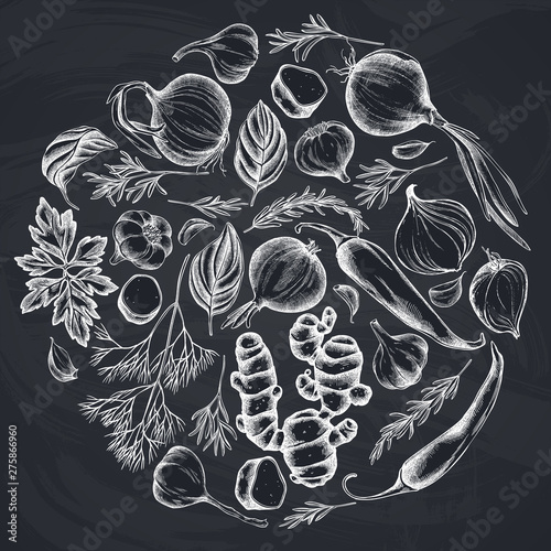 Round floral design with chalk onion, garlic, pepper, greenery, ginger, basil, rosemary