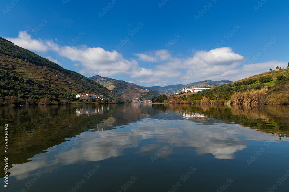 Scenic view of the Pinhao village with terraced vineyards and the Douro River and the Douro Valley, in Portugal; Concept for travel in Portugal and most beautiful places in Portugal