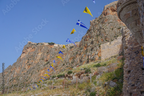 Monemvasia, Greece: Greek and Byzantine Empire pennants at the entrance to the medieval fortress town of Monemvasia (founded in 583 AD).