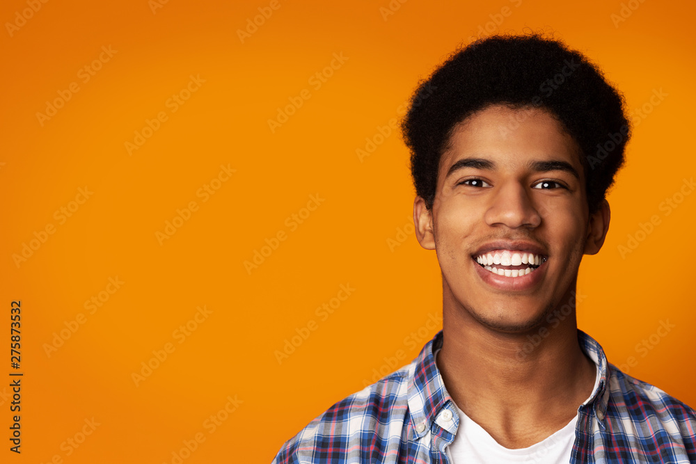 Teeth Whitening. Afro Guy Smiling Widely in Studio Teeth Whitening. Afro Guy Smiling Widely in Studio