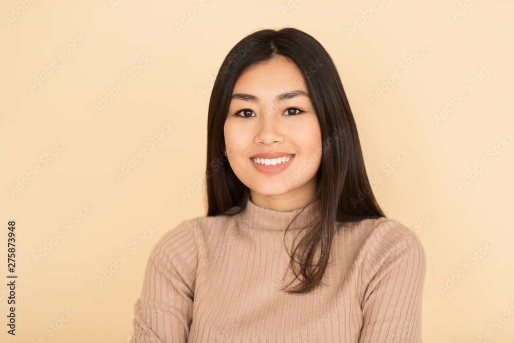 Portrait of Cheerful Asian Girl Smiling to Camera Portrait of Cheerful Asian Girl Smiling to Camera
