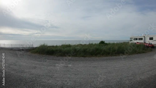 Time lapse - View of Cook Inlet, Mr Redoubt, and Campground at Deep Creek Recreational Area in Alaska