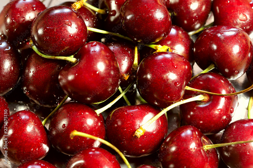 Background texture of fresh red cherry berries. View from above, horizontal, close-up. The concept of healthy nutrition and agriculture. Background texture of fresh red cherry berries. View from above, horizontal, close-up. The concept of healthy nutrition and agriculture.