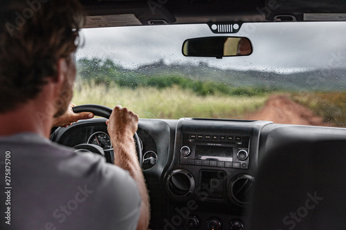 Obraz na plátne Man driver driving off road trail path with 4x4 car on adventure trip travel holiday