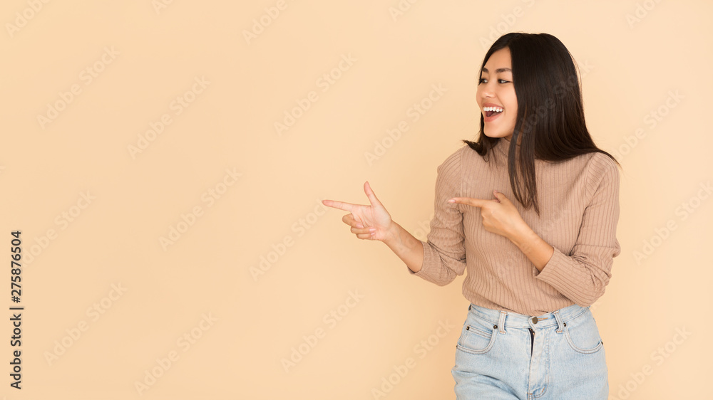 Cheerful Girl Showing Empty Space With Fingers Cheerful Girl Showing Empty Space With Fingers