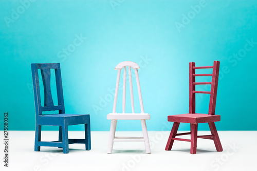 Three miniature chairs.