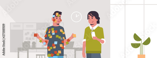 boss with male manager covered with stick notes business planning teamwork concept couple businessmen standing together modern office interior flat horizontal portrait
