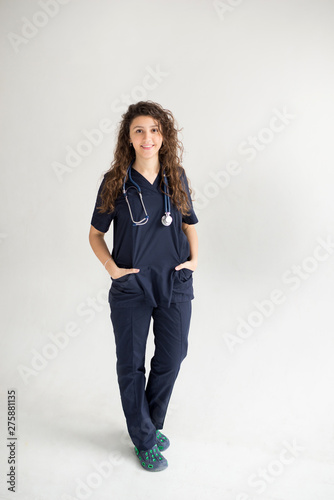 Female Doctor with Hands in Pockets isolated on white background, copy space