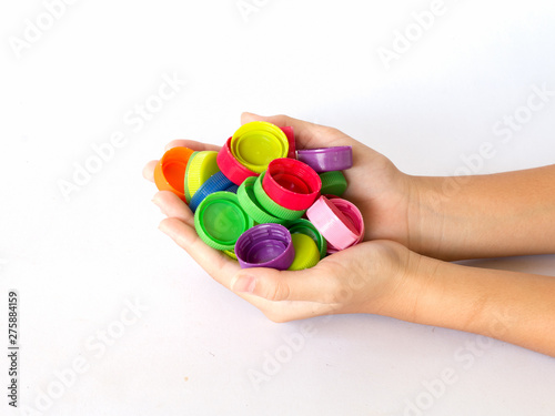 recycle plastic bottles caps in hand holding. recycling To conserve the environment concept