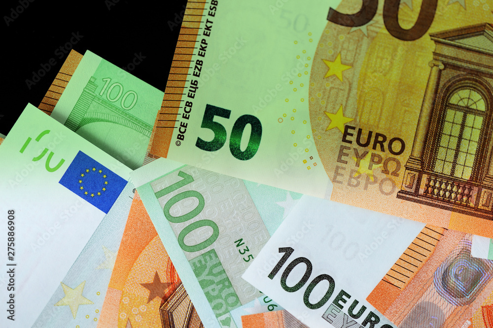 One Hundred and Fifty euro banknotes green color toned close up One Hundred and Fifty euro banknotes green color toned close up