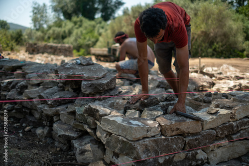 Dry stone wall construction in the south of France