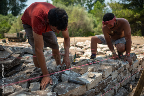 Dry stone wall construction in the south of France