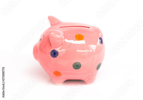 Pink ceramic piggy bank on white background, saving money concept