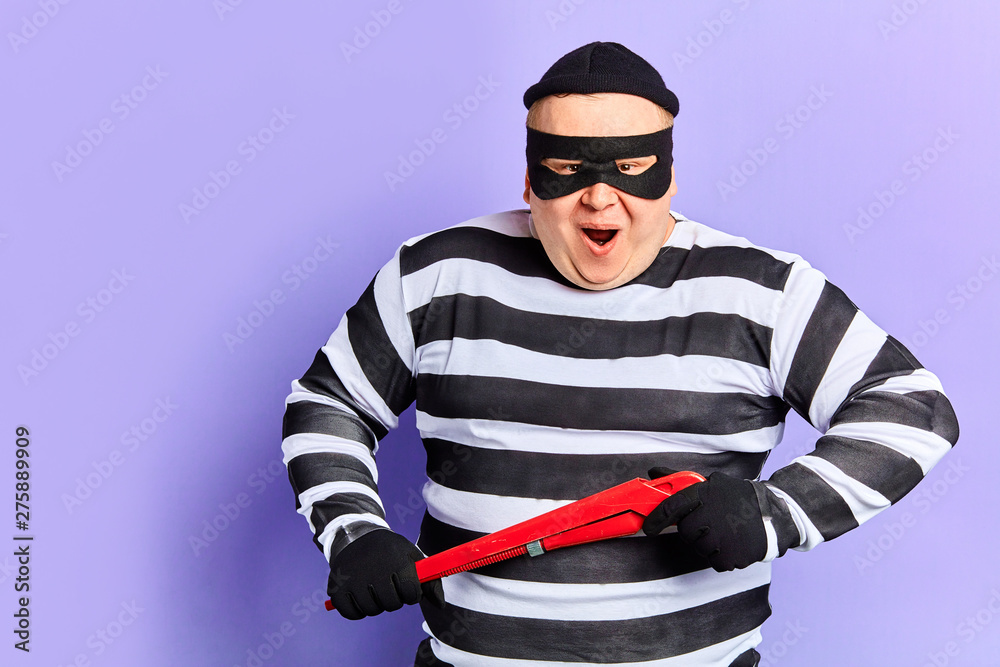excited happy criminal looking forward to blowing open safe, bank.prisoner wants to burst the door. offense concept excited happy criminal looking forward to blowing open safe, bank.prisoner wants to burst the door. offense concept