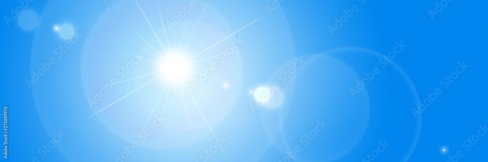 Lens flare light effect. Sun flash with ray and glow on blue sky background. Lens flare light effect. Sun flash with ray and glow on blue sky background.