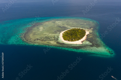 White sandy island with coral reefs.White sandbar.Atoll near the island of Camiguin, Philippines, aerial view.Seascape, white sand island