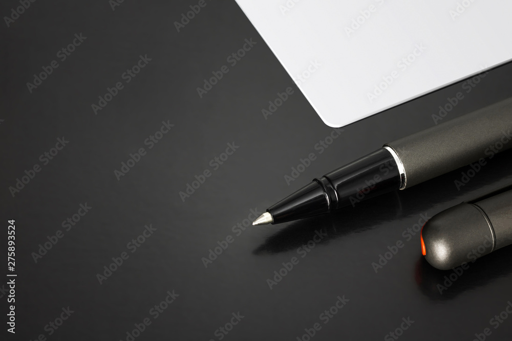 Ballpoint pens and blank name card on business background with contact concept. Ballpoint pens and blank name card on business background with contact concept.