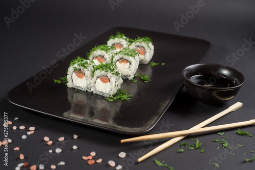White japanese sushi on black background