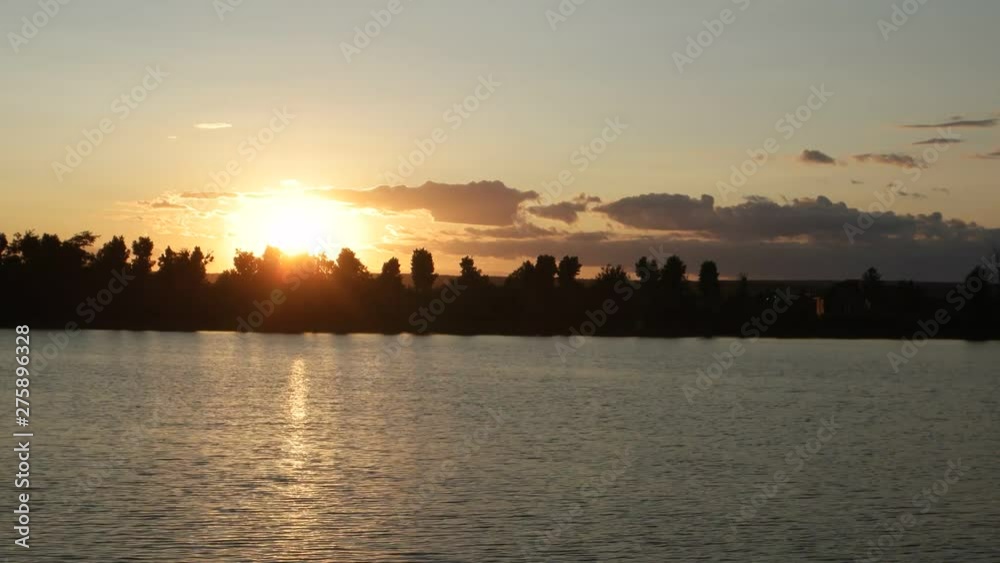 Sunset on the lake in summer, time lapse Sunset on the lake in summer, time lapse