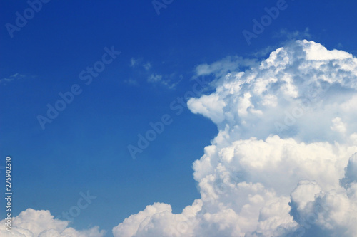 Landscape of cumulonimbus clouds floating in sunny summer sky
