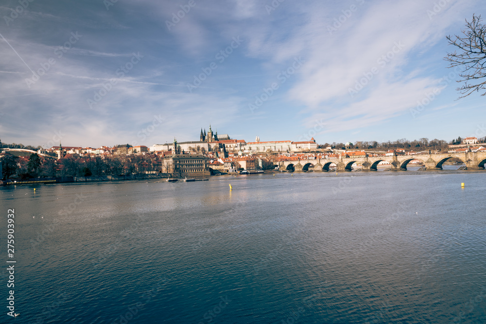 Praha city panorama with Vltava river, Karluv most bridge and Prazsky hrad castle from Smetanovo nabrezi in Czech republic