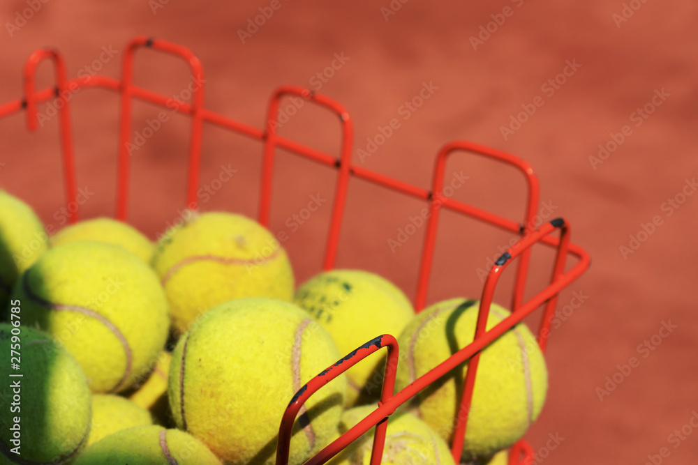part of basket with yellow balls for learning to play tennis, tennis academy concept