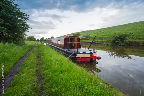 Foto Narrowboat on a British canal in rural setting