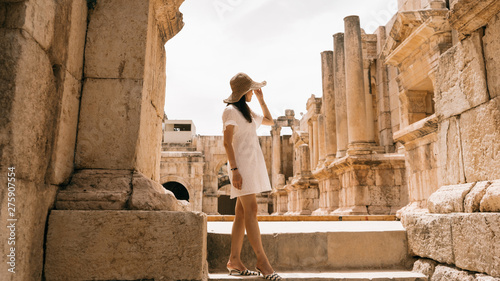  Beautiful asian woman wear hat with smile happy leisure at Jerash is Jordan's largest and most interesting Roman site, and a major tourist drawcard. Most casual fan of archaeology 