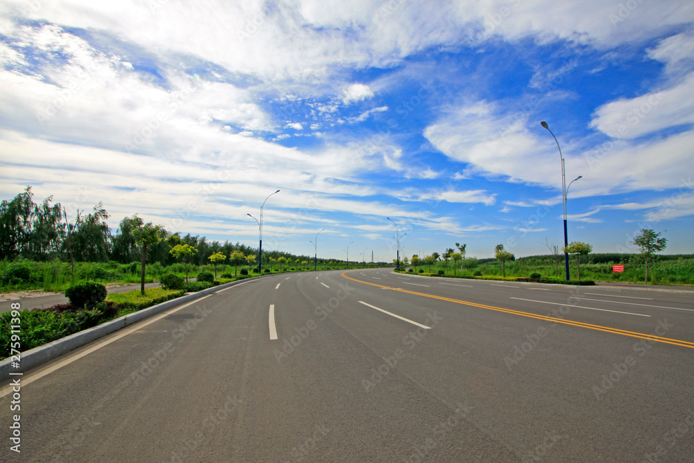 highway under the blue sky white cloud