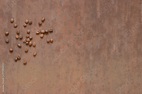 Coffee beans on rusty, scratched metal