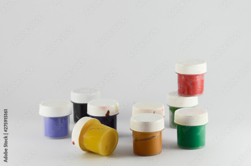 Bright Isolated small cans with gouache and acrylic paint Bright Isolated small cans with gouache and acrylic paint