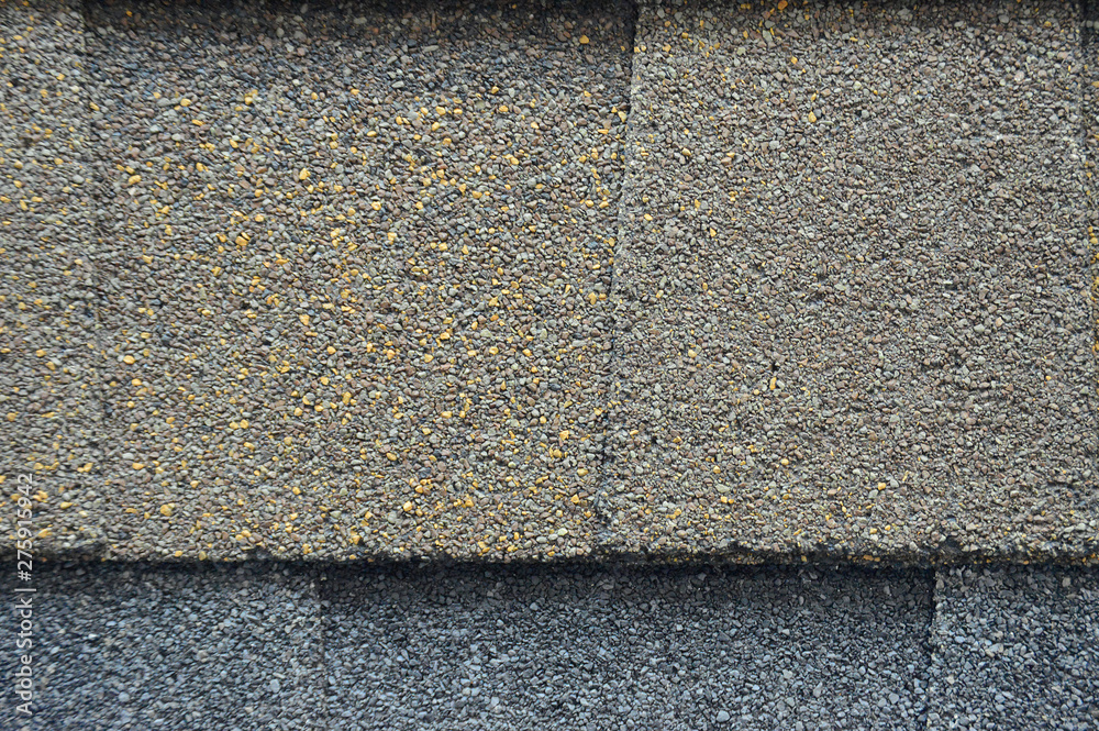The texture of the rubberized asphalt crumb on the treadmill. The roof of the building is covered with concrete and resin. Background small pieces of brick The texture of the rubberized asphalt crumb on the treadmill. The roof of the building is covered with concrete and resin. Background small pieces of brick