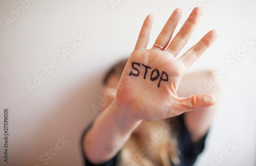 Woman shows palm with the inscription on the palm 