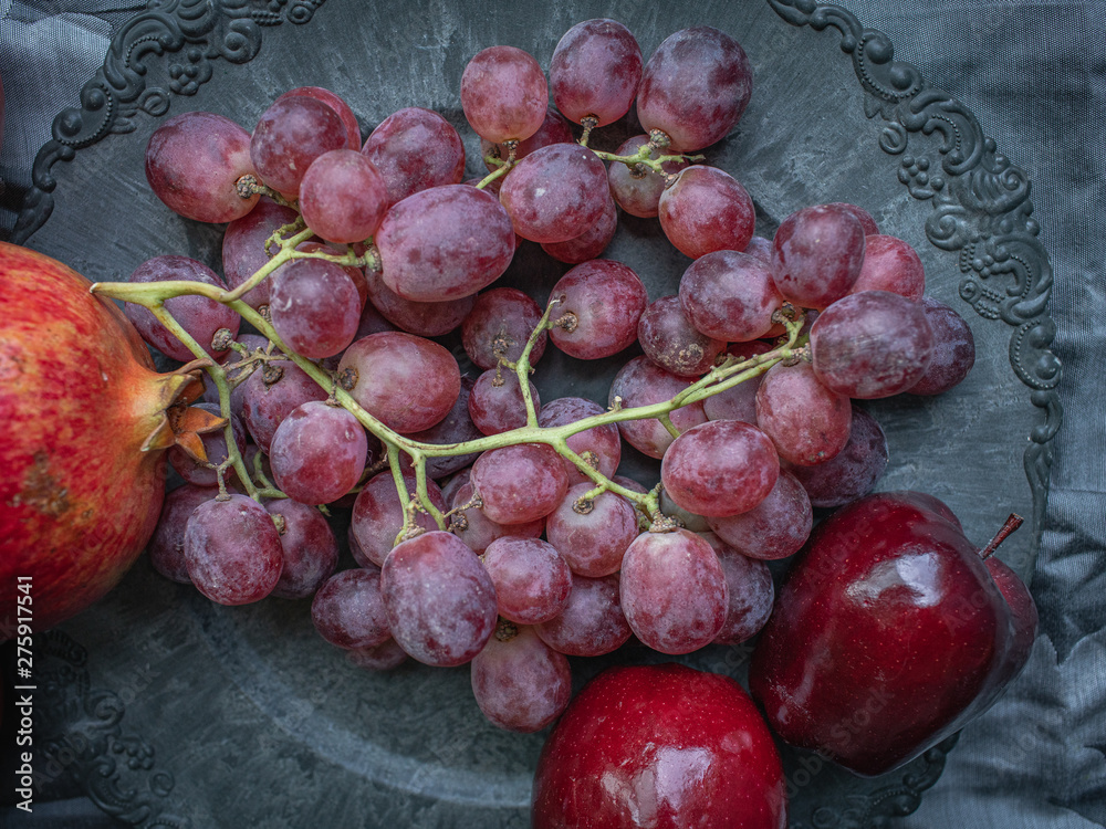 Decorative eastern dish with natural fruits, view from above. Decorative eastern dish with natural fruits, view from above.