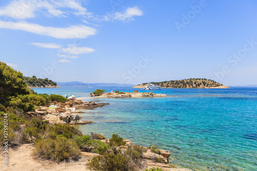Wonderful summer seascape of turquoise sea water and yacht at coast Sithonia on Halkidiki Greece © mitarart
