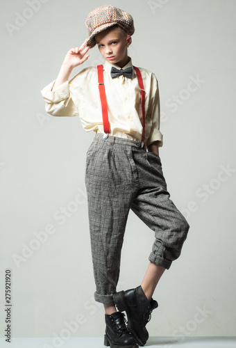 Photography teen girl in retro male suit