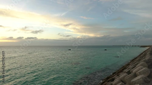 Shimoji island, Japan-June 27, 2019: (15x times) Sunset at the north of Miyako Shimojishima airport  photo