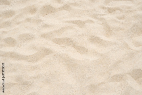 Cream color of sand texture background.