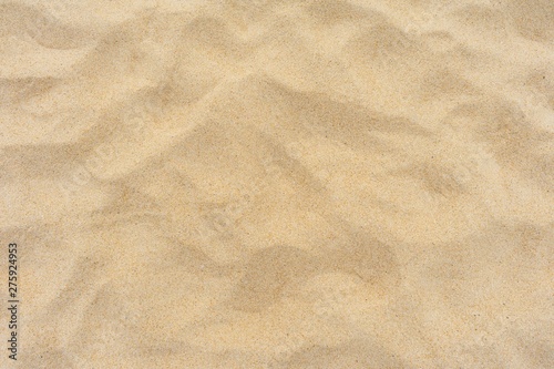 Yellow beach sand texture as background.