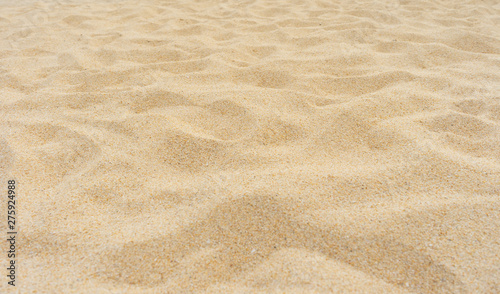 Yellow beach sand texture as background.