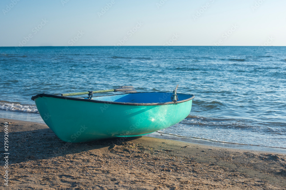 Fishing boat on the beach . Boat with oars Fishing boat on the beach . Boat with oars