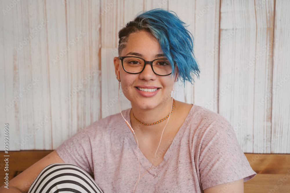 Stylish blue short hair with a lesbian cut. Stock Photo | Adobe Stock