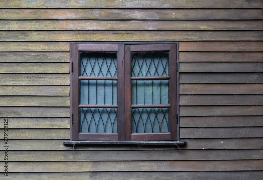 Wooden window on wood wall background. Texture vintage for interior.