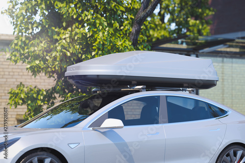 Luggage trunk box mountained on car roof rack. 3d rendering. photo