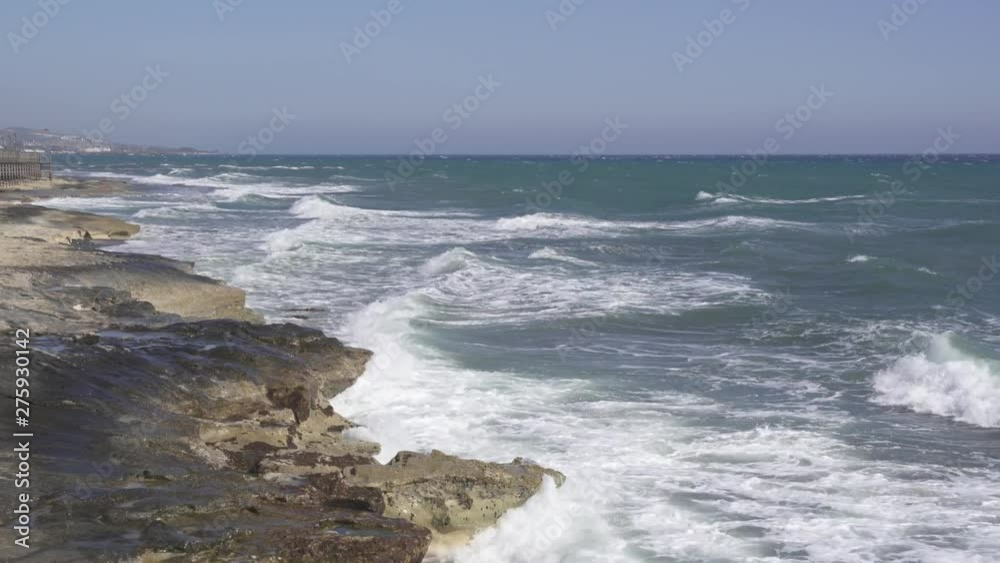 Tidal waves breaking on a rocky shore of Ancient Amathus archaeological site in Limassol, Cyprus Tidal waves breaking on a rocky shore of Ancient Amathus archaeological site in Limassol, Cyprus