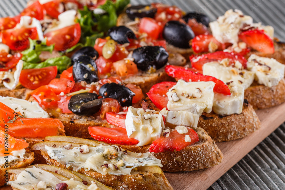 Assorted bruschetta Set of various appetizing snacks sandwiches Assorted bruschetta Set of various appetizing snacks sandwiches