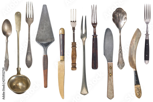 Vintage Silverware, antique spoons, forks, knives, ladle, cake shovels isolated on isolated white background. Antique silverware. Retro.